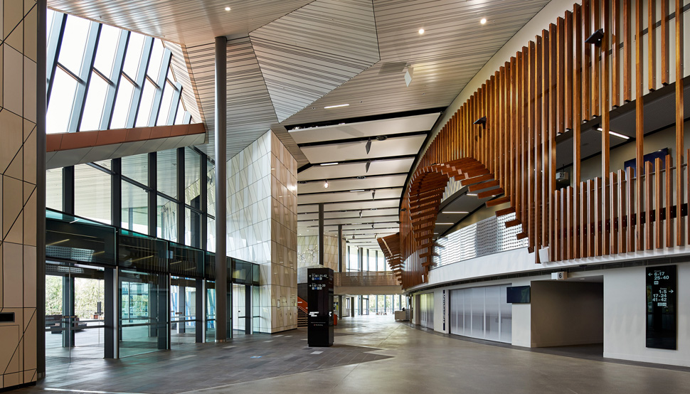 Low-rise, slender compression and light- filled circulation zones feature in the main foyer