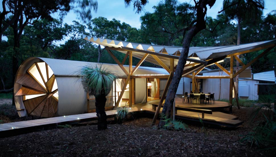 The living space is encapsulated in a steel cylinder with a louvred timber window at the end for ventilation.