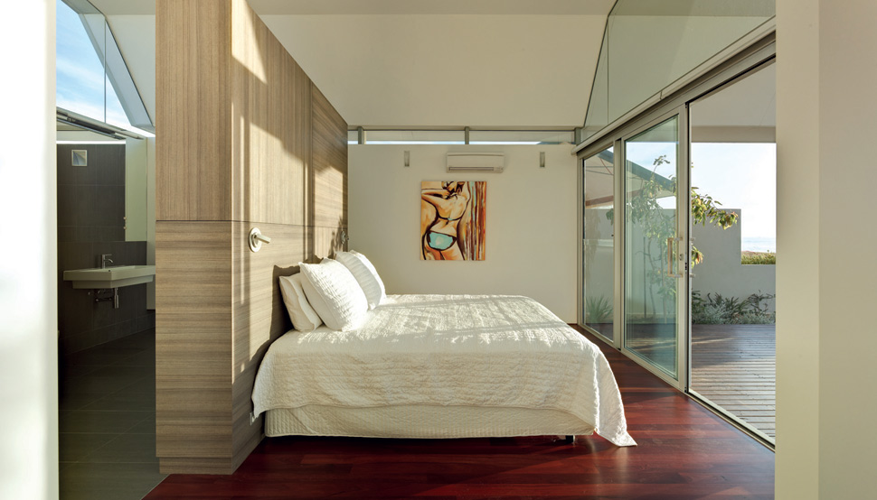 The master bedroom holds views towards the ocean.