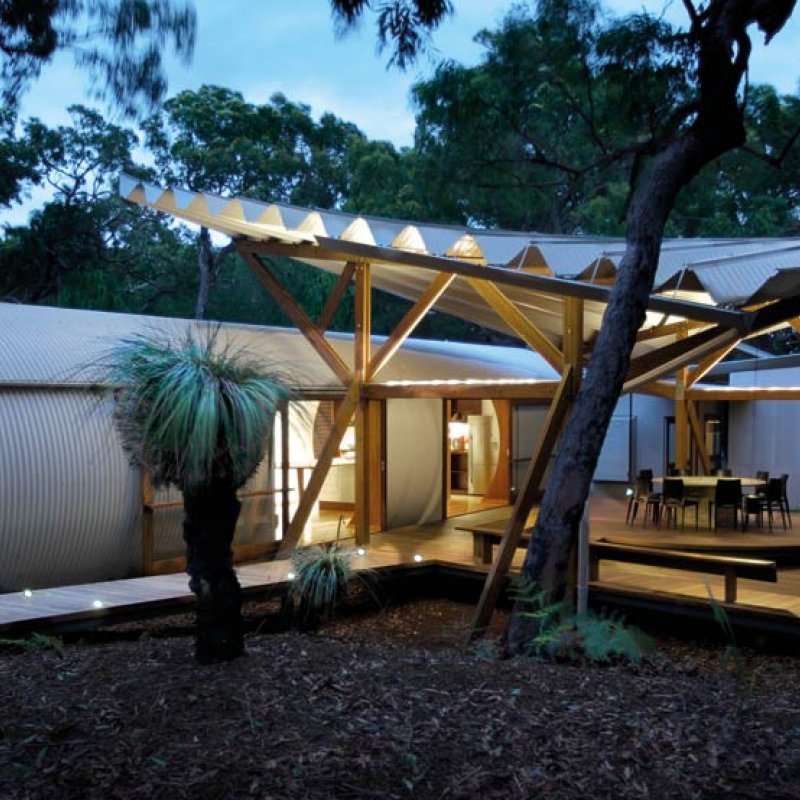 The living space is encapsulated in a steel cylinder with a louvred timber window at the end for ventilation.