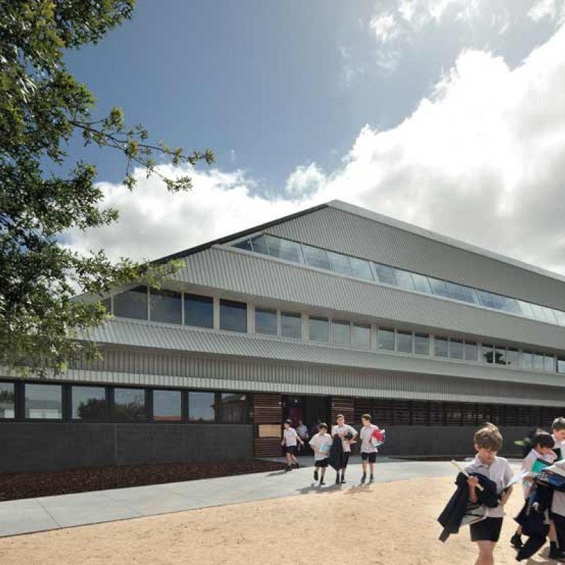 Penleigh and Essendon Grammar School (PEGS), western façade conjures up multiple references: the students have nicknamed it ‘Starship Enterprise’ because of the sci-fi appearance of the striped steel roof, which diagonally slices the extruded form. 